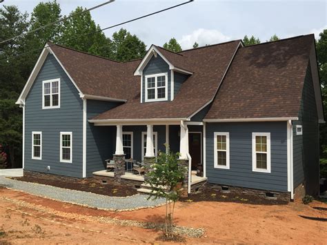 blue house white trim brown metal roof|blue house roofing colors.